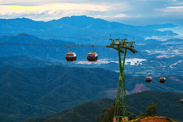 cabanas of a funicular on a cable car in the mountains at the Ba Na Hills park in Da Nang in...