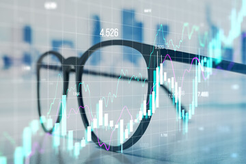 Financial data visualization with charts and graphs overlaying glasses on a blurred background. Concept of trading and market analysis.