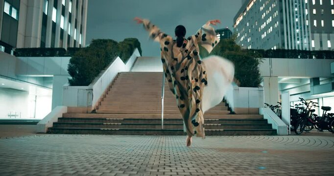 Woman, street and dance at ballet performance, creative or urban choreography at night in Japan. Ballerina, outdoor and girl practice art, freedom and rhythm for energy in exercise rehearsal in city