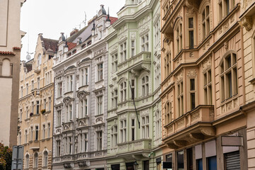 Facades of architecturally beautiful buildings in the Jewish quarter of the city of Prague, Czechia.
