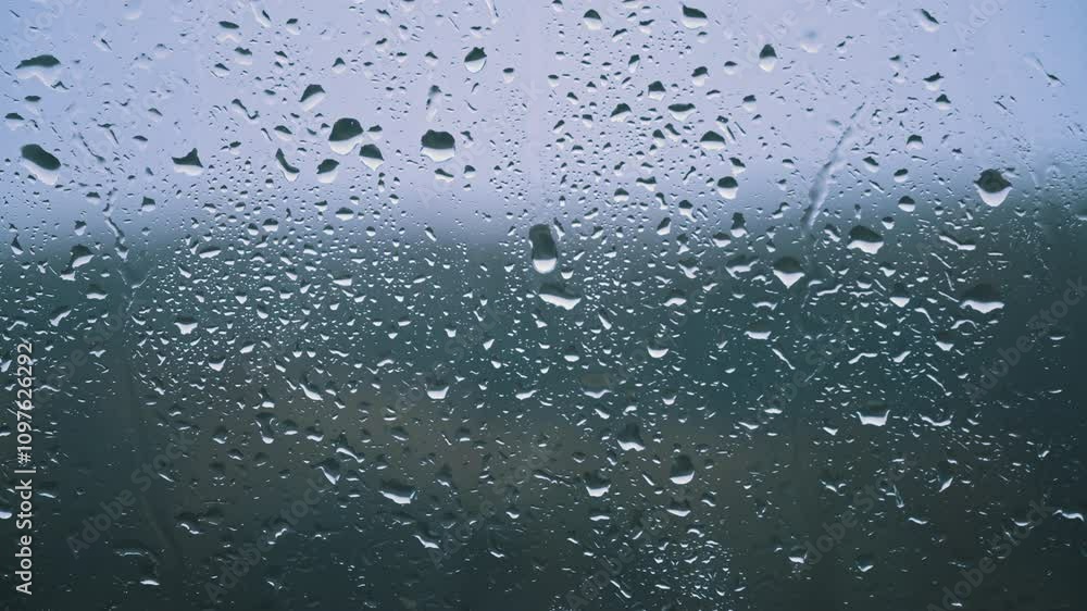 Poster abstract close-up of numerous rain droplets on a window, creating a textured and atmospheric visual.