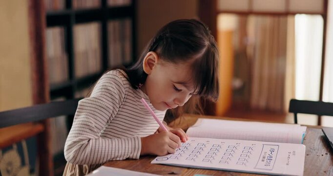 Education, student and child in home, book and writing of homework, academic and knowledge for girl. House, learning and studying for growth, development and preparing for exam, math and Japan