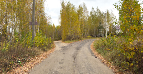 A road with a sign on the left side