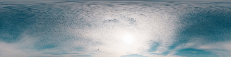 Sky 360 panorama - Bright blue sky filled with fluffy white Cirrus clouds. Seamless hdr spherical 360 panorama. Sky dome sky replacement for aerial drone 360 panoramas. Weather and climate change