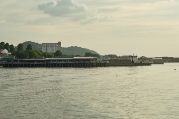 Seaside houses and community thrives along the coast, where the ocean meets the shore.