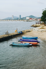 Boats on sea near the sandy beach