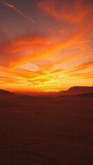 Vibrant oranges and yellows create a stunning gradient effect in the western sky, natural wonder, sun setting, orange hues, gradient effect