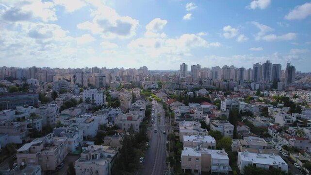 The city of Holon and the residential areas in the city center with the skyline of the city building in the new neighborhoods