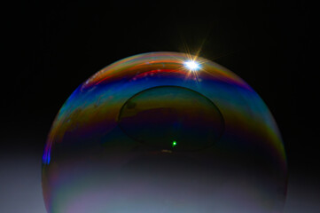 International Blowing Bubbles Day. NATIONAL BUBBLE WEEK. Soap bubbles isolated on a black background. Copy space.