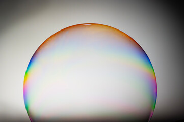 International Blowing Bubbles Day. NATIONAL BUBBLE WEEK. Soap bubbles isolated on a black background. Copy space.