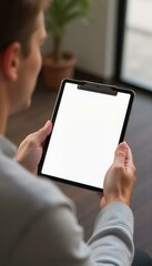 Man Holding Tablet with Blank Screen, Modern Office Concept.  Perfect for Mockups, App Presentations, or Technology Related Designs.