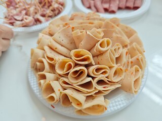 Rolls of ham in bouquet form