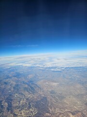 Spain, October 09, 2024: High flight in the mountains of the spanish coast. Aerial drone view to the cities, seaside and mountains. Beautiful landscape from the clouds.