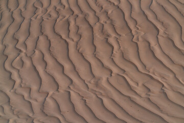 Natural texture formed by the wind on the surface of the sand