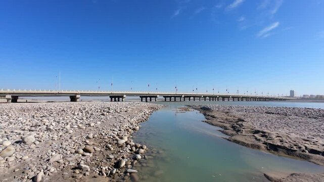 POV walking along Yulong Kashi river beach in Hotan, Kashgar, Xinjiang, China. It is the main production area of Hotan Jade, people come here try to find raw jade by luck, 4k real time footage.