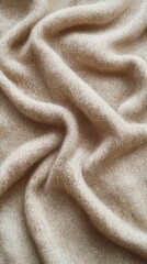 Fototapeta premium Soft beige fabric draped elegantly, exuding warmth and comfort.