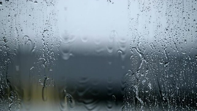 Drops of water on the window. Rain. Blurred background and textures.