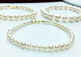 Obraz premium Classic Jewelry Collection of Three White Pearl Bracelets