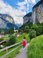 A serene walk along the lush trails of Lauterbrunnen Valley in Switzerland on a sunny day