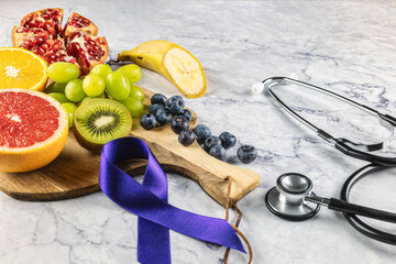 Antioxidant and anticancer fruit. Purple ribbon and a stethoscope. Prevention and fight against...