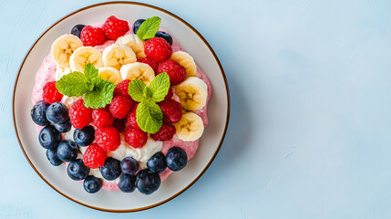 Fresh fruit dessert with bananas, raspberries, and blueberries