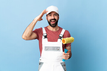 Adult painter man over isolated blue background has realized something and intending the solution