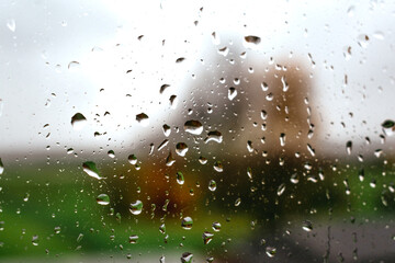 Drops on a window with a beautiful background