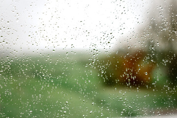 Drops on a window with a beautiful background