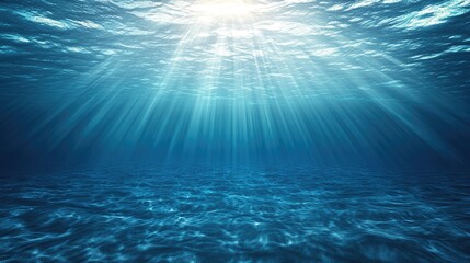 Obraz premium Beneath the serene surface, bright rays of sunlight dance through the tranquil blue ocean depths.