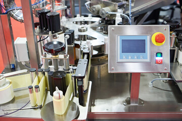 Machine for filling liquids into plastic tubes