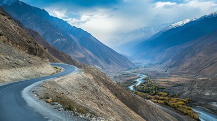 Obraz premium Road winding through a mountainous area, capturing the thrill of an adventure drive