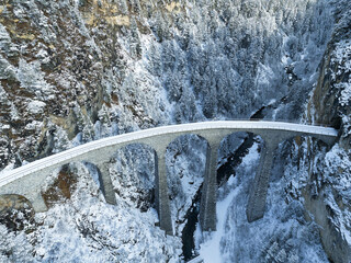 Aerial view of famous Landwasser Viaduct Unesco world heritage site in the Swiss Alps at mountain...