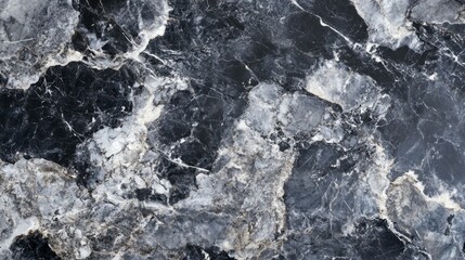 Fototapeta premium A black and white photo of a stone wall with a greyish blue hue
