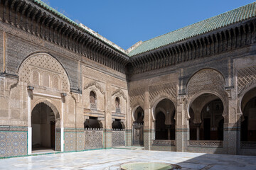 Fototapeta premium Bou Inania complex in Fes, Fès, Fez, Morocco. Courtyard, archs, mosaic, zellige, medersa, architecture.