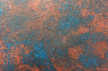 abstract art background of blue stains on red