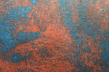 abstract art background of blue stains on red