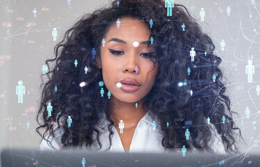 Woman focusing on data with holographic digital connections and