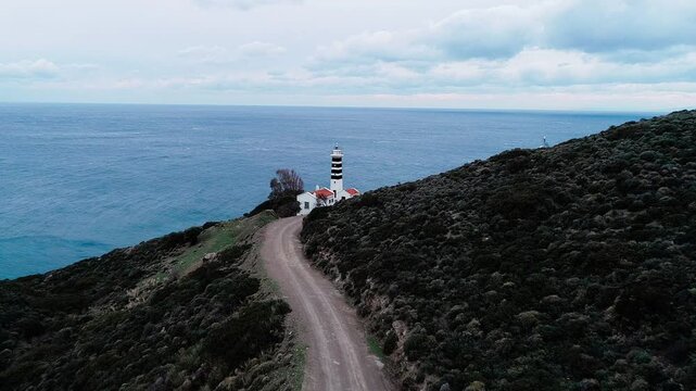 Sarpincik Historical Lighthouse, Izmir - High quality video of Izmir Sarpincik Lighthouse taken from the air with a drone on a cloudy day
