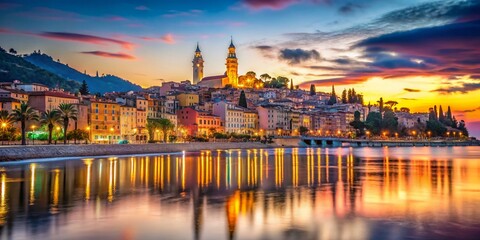 Obraz premium Long Exposure Time Lapse of the Stunning Menton France Skyline at Sunset, Capturing the Vibrant Colors of the City Reflected on the Beach and Water Surface
