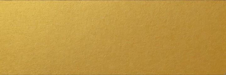 Fototapeta premium a rectangular piece of fabric or material with a solid gold color. The texture appears to be smooth and slightly reflective, giving it a metallic sheen. There are no patterns or additional elements 