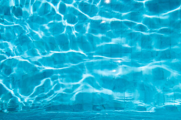 Blue Water Pool Surface with Sunlight Reflections