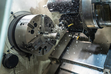 Lathe operating in a numerical control factory
