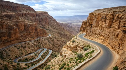 Winding Mountain Road Through Steep Canyon Landscape