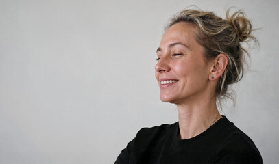 Fototapeta premium Portrait of a smiling woman with natural expression