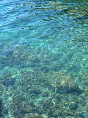Crystal clear turquoise sea water surface 