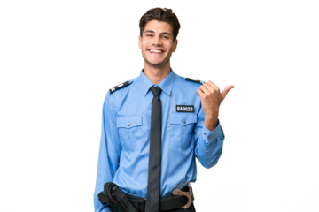 Young police man over isolated background pointing to the side to present a product