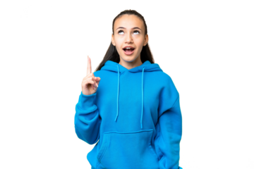 Young Arabian woman over isolated chroma key background pointing up and surprised