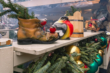 Decorative figurines of birds on the street during the New Year holidays. Festive decoration in...
