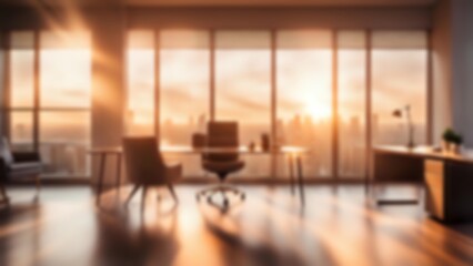 Fototapeta premium Blurred office room with large window bathed in the soft warm light of the sunset