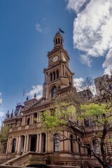 Fototapeta premium Historic clock tower building under a clear blue sky